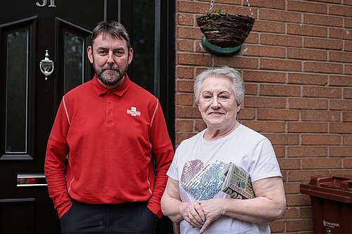 Photo of Neighbours Francis Granger and Sheila Paton outside a front door on Aden Close (Image: Kenny Brown)