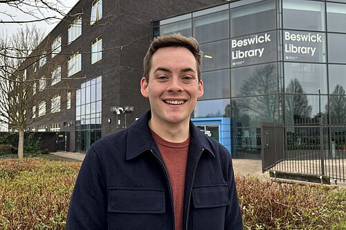 Lib Dem campaigner Luke Allan infront of Beswick Library.