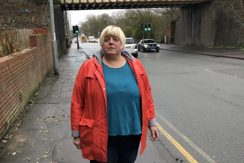 Jackie Pearcey at the Hyde Road Bridge to be demolished in the road widening.